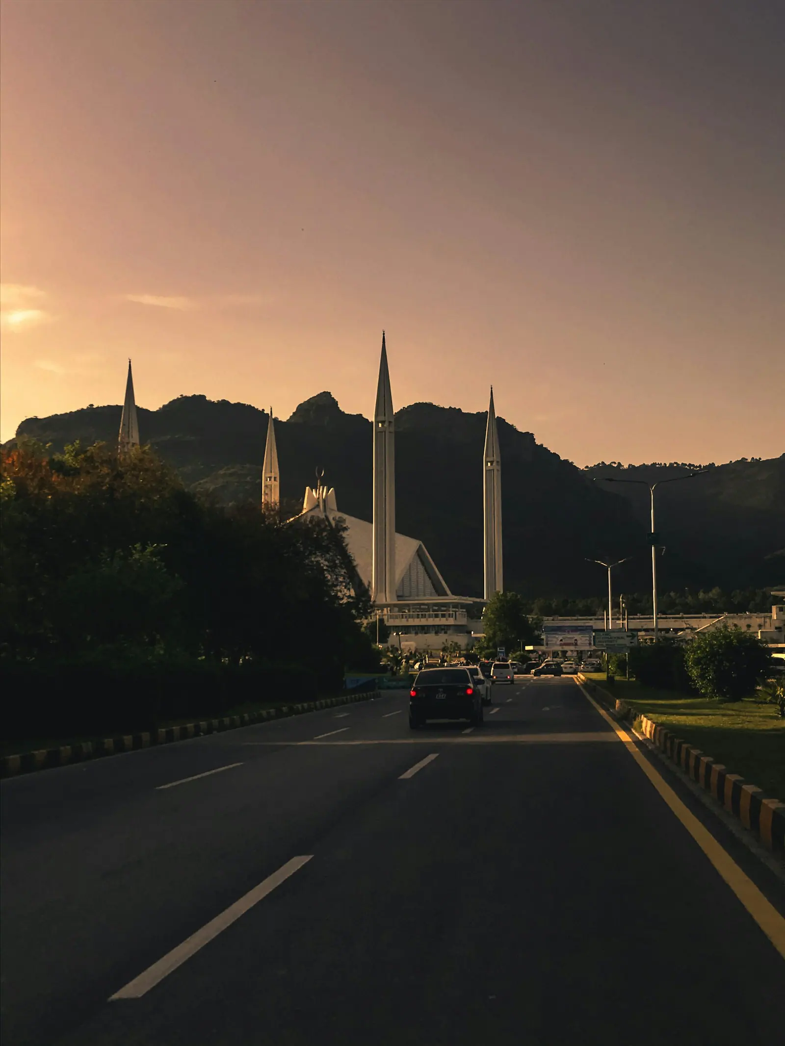 Main avenue at dusk with Margalla Hills behind, Islamabad Zone 4